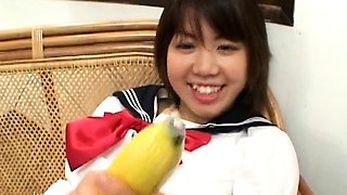 Asian teen with a banana
