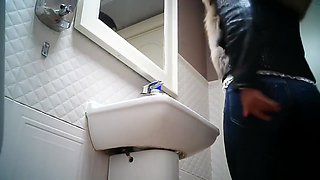 Women pee in public toilet 2259