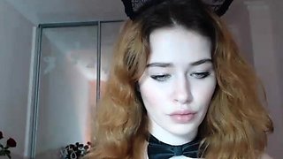 Busty redhead babe strips and masturbates