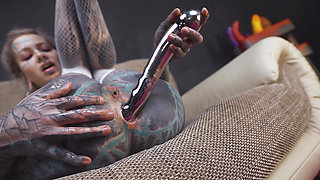 Anuskatzz grabs her cold, stainless steel toy and slides it deep into her tight ass