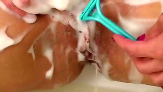 Lucilla shaving her pussy