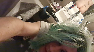 Crossdresser Pina in Bathroom Green Wig