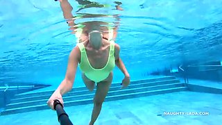 Naughty MILF Lada Flashes Her See-Through Wet Swimsuit at Public Pool