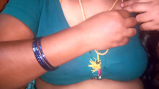 Tamil aunty squeezing her breasts when she is alone and unable to control her emotions.
