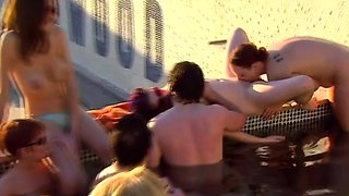 Oral sex in a pool party for a petite swinger brunette.
