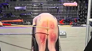 Slave in Chastity Cage Gets a Cruel Caning