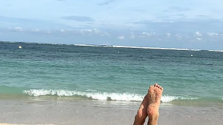 Teasing on the Beach in Micro Bikini on the Sand