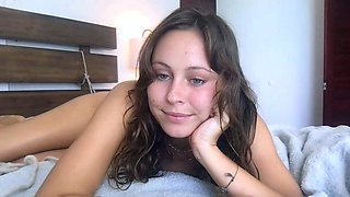 Small titted brunette teen fingering on the bed