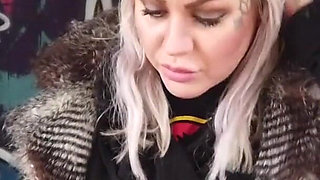 Blonde lady smokes an electronic cigarette