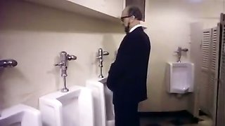 Extremely hot classic porn scene in a toilet stall