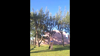 Stepmother in a Bikini in the Garden of the House Makes a Video for Her Stepson, to Show off Her New Clothes.