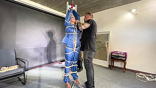 Ms Ungeniert Tied, Gagged, Suspended Ind A Shiny Nylon Rainsuit And Finally Bullwhipped