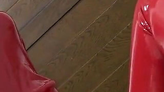 Hot Babe in Red Latex Jumpsuit Pumps Big Guys Cock