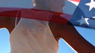 Curvy petite brunette strips at a beach