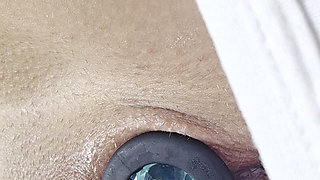 Fetish girl Ana Liz puts a butt plug in her pussy and then in her ass