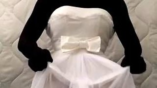 Black nylon doll with short white wedding dress