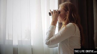 Sexy redhead masturbating as she spies on her gorgeous neighbor