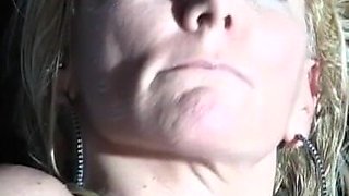 Oiled up blonde milf with big tits fucks pussy with glass dildo