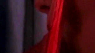 Redhead nurse sucks cock at a gloryhole