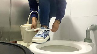 Sexy Girl Is Captured in Public Restrooms in Shopping Mall
