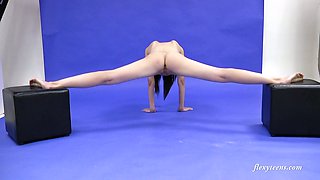 Slender Russian teen Galina Markova does the splits and shows bald pussy