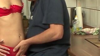 Mature pierced brunette in lingerie, stockings, and heels gets fucked with the kitchen repairman