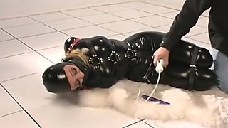 hogtied in latex catsuit