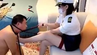 Chinese mistress punishing handcuffed slave