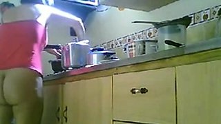 LATINA MATURE NUDE KITCHEN