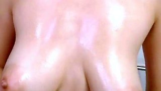 Oiled up babe having fun masturbating