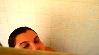 Fat amateur brunette puts herself on display in the shower