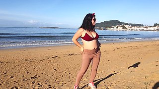 Woman Pissing on a Public Beach While No One Is There