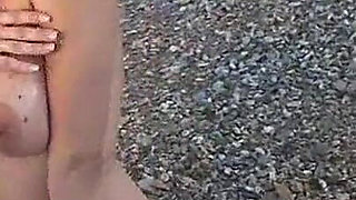 Busty Adrianne Playing on Beach.