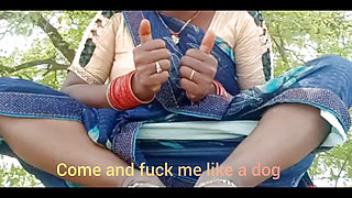 Asking pleasure outdoor in the farm sitting wearing saree .