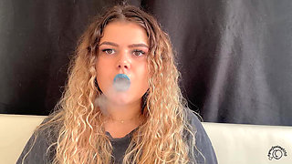 Exotic Goddess with Wild Hair Blows Smoke for You