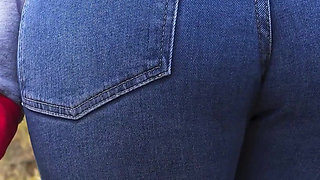 MILF In Blue Jeans Bends Over And Flashing Her Big Ass Outdoors