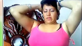Horny as fuck Mexican mommy is poking her twat with fat ass dildo