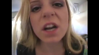 Blonde bitch smoking a cigarette in a close up video