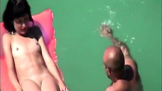 My nudist niece Emma floating in the sea (voyeur)