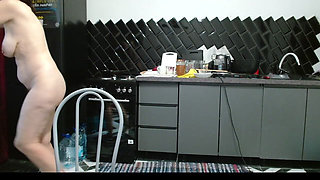 Uninhibited MILF Takes off Her Clothes and Wiggles Her Ass in the Kitchen Showing off Her Beautiful Toes