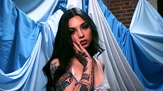 Taylor reveals her tattoo covered body