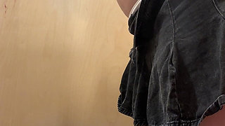 Fitting Room Observation of Young Redhead Woman