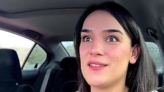 Tattooed brunette plays solo inside vehicle