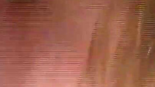 She Lies Naked on the Beach While He Watches Her