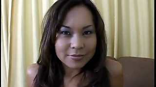 Asian lovely blows cock on her knees
