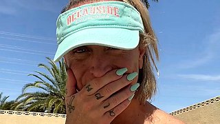 Blonde is flashing her big boobs in the outdoors