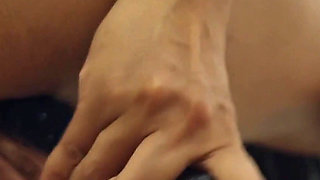 Asian MILF Masturbates by the Glass Dildo