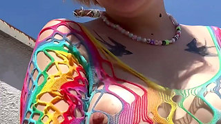 Smoking in a Rainbow Fishnet on the Balcony