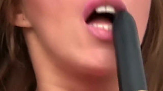 Tanned Beauty in Pink Lingerie with a Black Vibrator - Solo on the White Bed