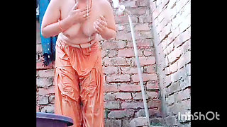 She is massaging her sexy' hot boobs, bathing, naked, and changing clothes.